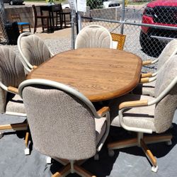 Dining Table And 6 Rolling Chairs 