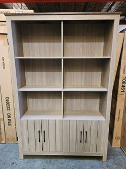 Oversized gray bookshelf cabinet