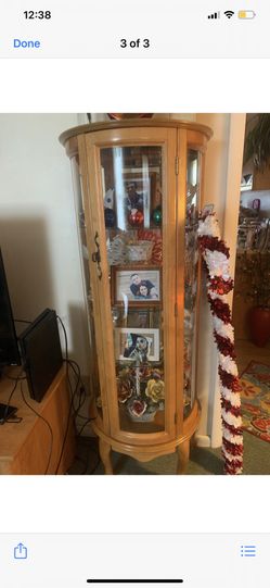 Wood and glass curio cabinet