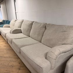 Delivery Available Beige sofa/ couch w pull out bed