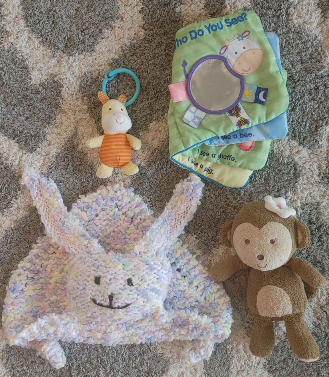 Lot of 4 plush toys - Car seat piglet, tag book, plush rabbit lovie and monkey rattle