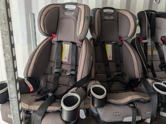 Three Graco 3-in-1 car seats.