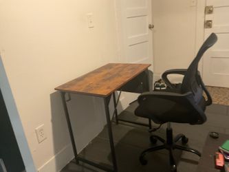 32 inch wood brown desk and black office computer chair. A year old