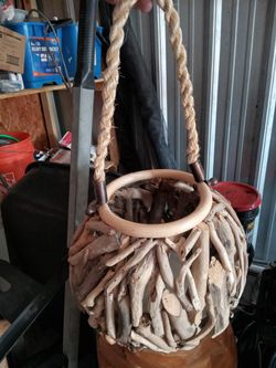 Wood Lamps And Tables And Some Hanging Baskets With Electric Candles 