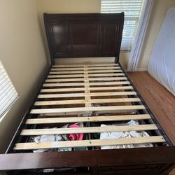 Queen sized cherry wood sleigh bed with storage