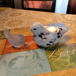 Two sweet looking birds ceramic and blue frost glass you can put candle in
