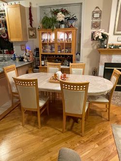 8 piece dining room set with padded chairs.