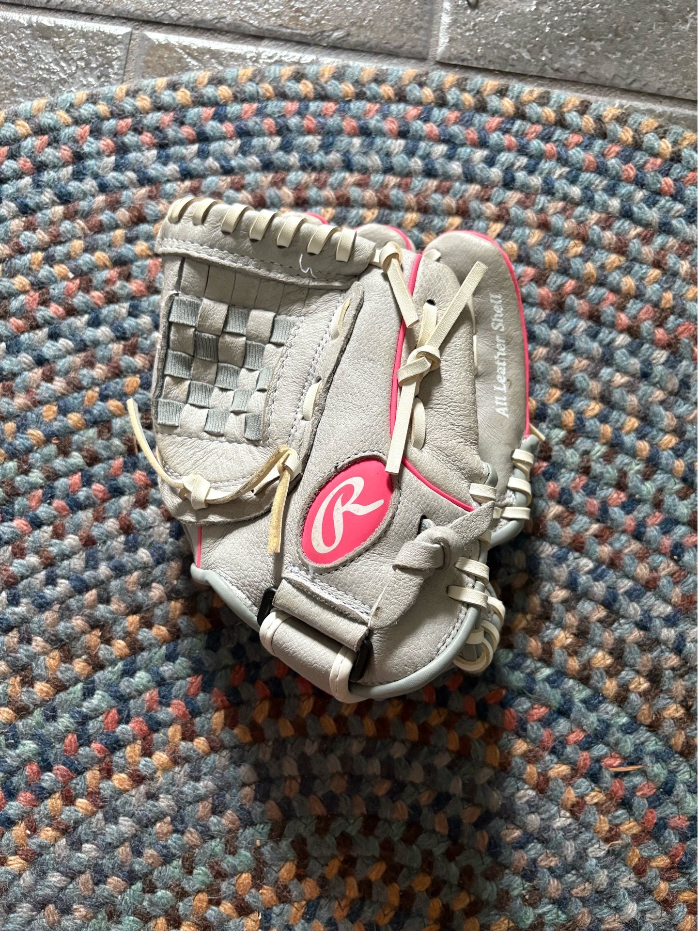 Grey and pink baseball glove