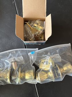 Kwikset Entry Lock, Schlage Dexter Deadbolt Lock, and Passage Lock. All Bright brass