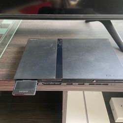 PS2 slim W/ Power And av Cables. Works Perfect. 