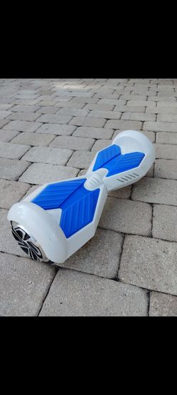 6.5 inch smart self balancing hoverboard. Solid rubber tires, sleek modern design. Working good. No charger