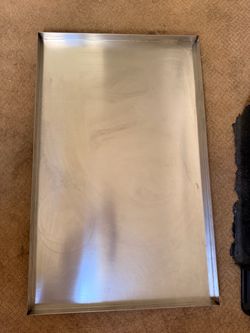 Stainless steel replacement tray for a 42-inch dog crate. Measures approximately 41” x 26”.