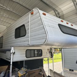 1996 10.5’ Northland Truck Camper