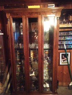 huge 2-door 3 shelf glass cabinet.