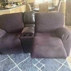 Brown sofa and loveseat all recline.