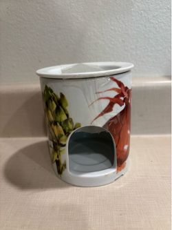 Candle holder ceramic with vibrant vegetables around it