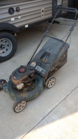 50$. Lawnmower , runs and cuts