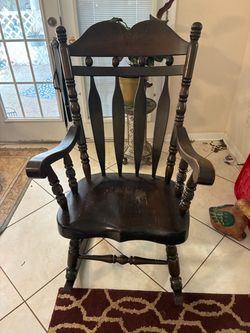 Dark wood rocking chair