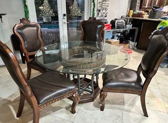 Table and genuine leather chairs