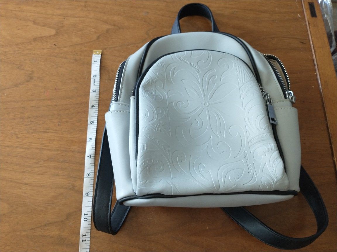 Happy Wahine mini grey backpack 2 zipper pockets and adjustable straps
Great condition