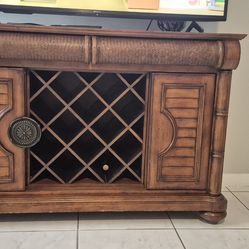Cindy Crawford TV stand with wine storage.