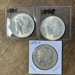 Three Morgan Silver Dollars. Group 27.