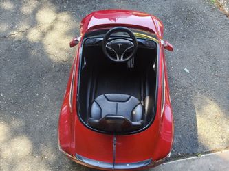 Kids Ride-On Tesla Toy Car – $180