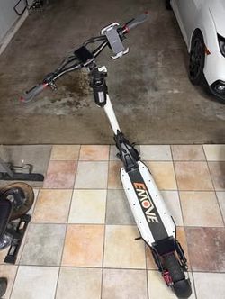 EMOVE Cruiser V2 – 52V Quad Suspension 62-Mile Long-Range Scooter