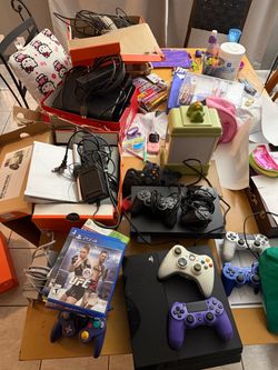 A lot of gaming consoles with controllers and games