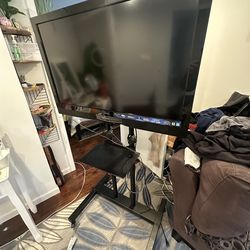 Rolling TV Stand With 36 Inch TV