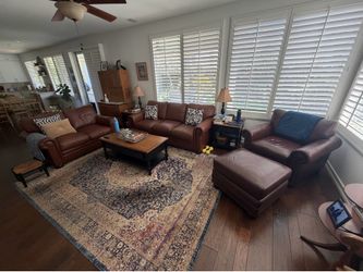 Brown leather sofa, love seat, chair and ottoman