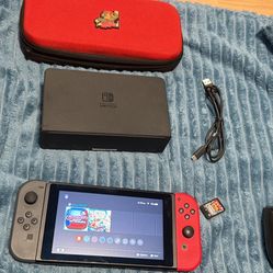 Nintendo switch with docking station, charger, Joycon grip, two games (ctr nitro fueled & stern pinball arcade)and Mario case. No trades cash only 