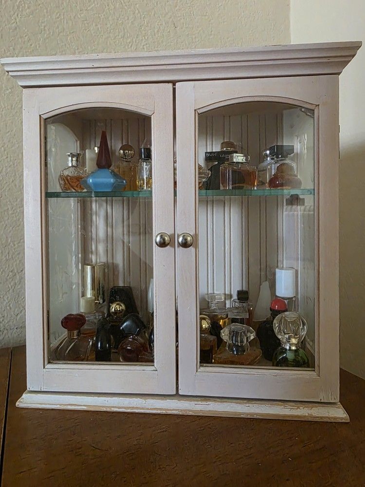 Small Cabinet Full of Full Perfume Mini Bottles