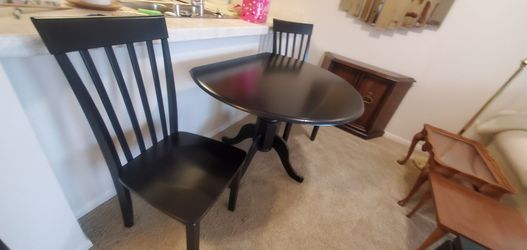 Drop leaf dining room table with two chairs