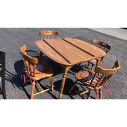 Good condition dining table with four chairs
