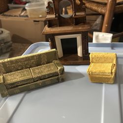 Miniature fireplace, couch, and chair
