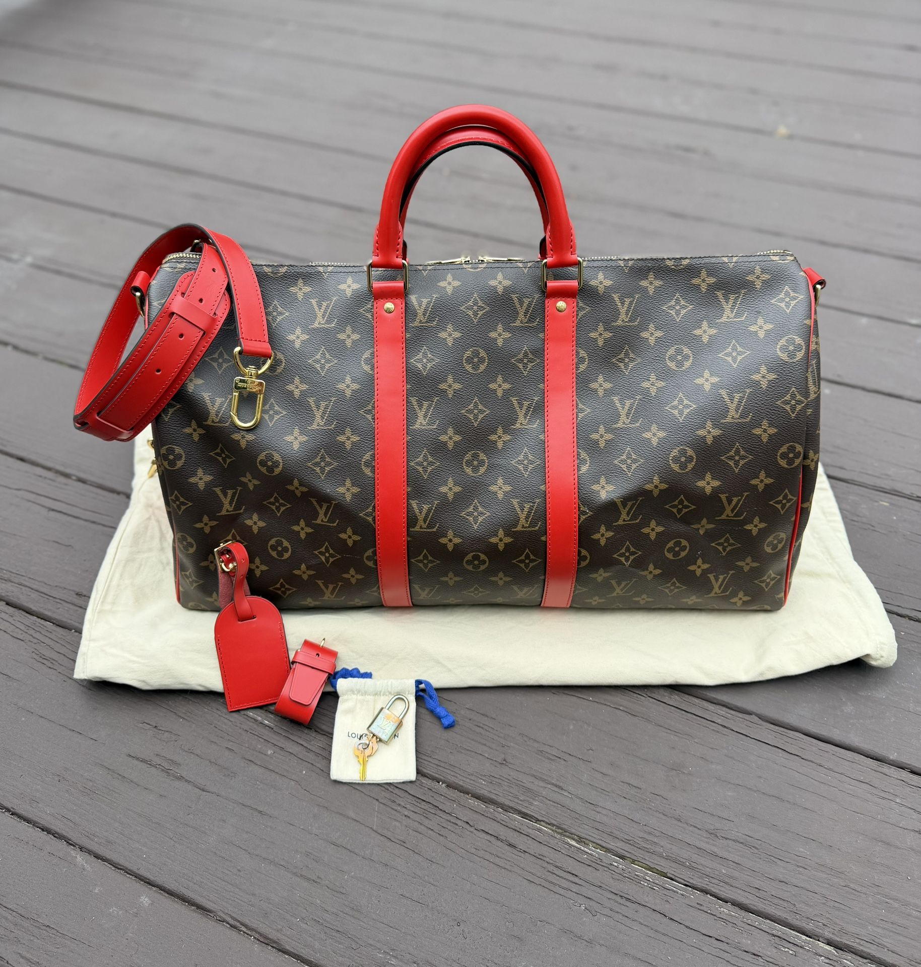 Louis Vuitton Keepall 50 Monogram Bandouliere Red Trim