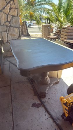 Big dining room table with nice leg stands and nice trim