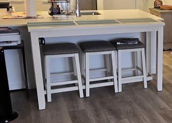 36" tall, beige table with 3 stools