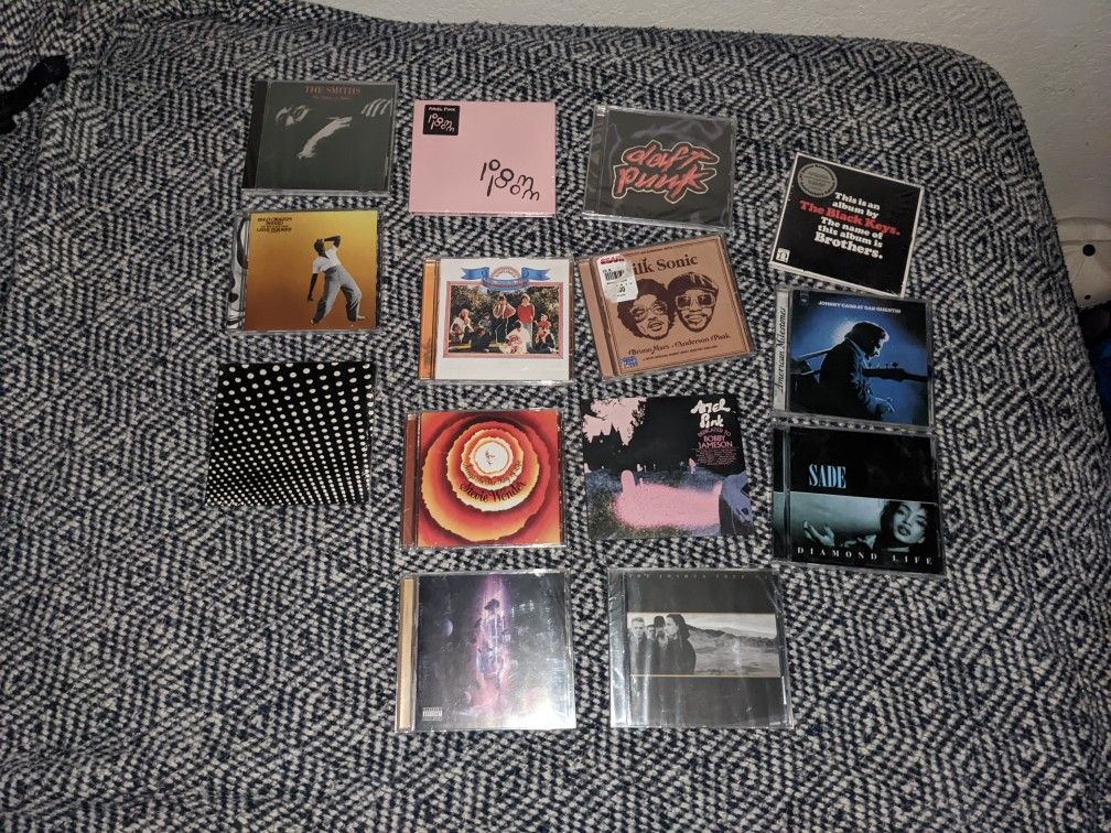 New CDs Still In Plastic