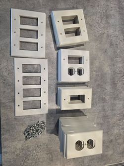 Assorted White Wall Plates and Screws