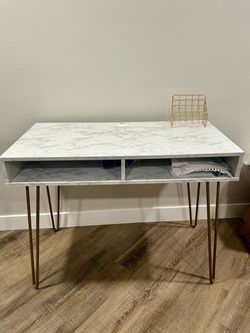Modern desk with gold accent legs
