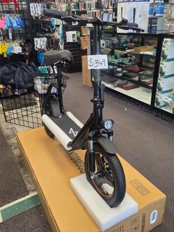 Electric scooter with seat and storage basket.  Cash offer