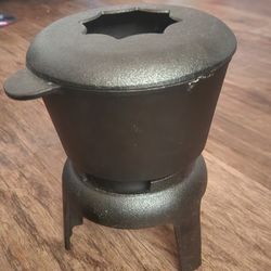 vintage cast iron fondue pot with stand