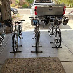 Three Bicycles With Parking Stands