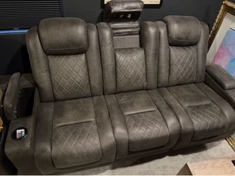 2 sets of matching 3 seat Auto reclining theater seats.