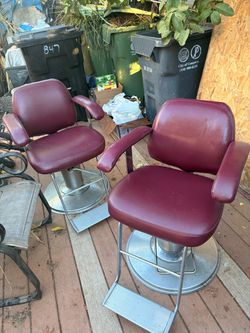 2 burgundy hair cut chairs. Both for $60