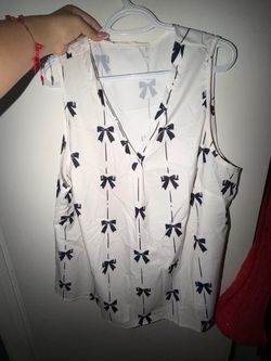 White Sleeveless Blouse with Black Bow Print