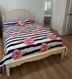 Cream upholstered full size bed