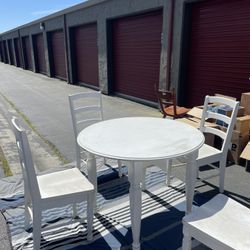 White Table Set With Four Chairs 